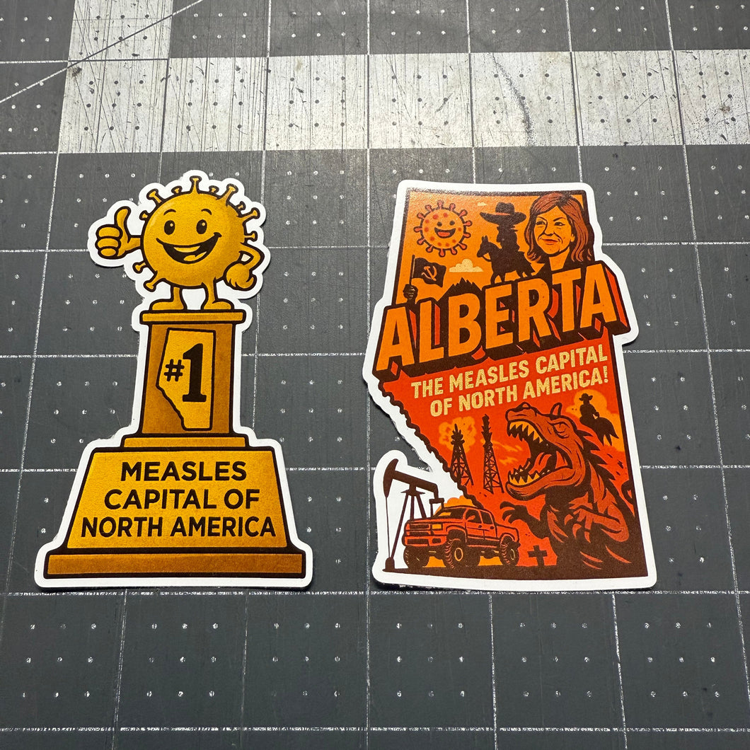 Two stickers on a grid background, one shaped like Alberta and the other resembling a trophy with text.