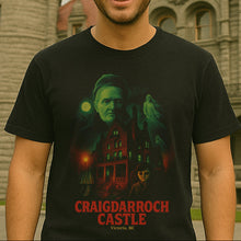 Person wearing a black t-shirt with a graphic design of Craigdarroch Castle and text.