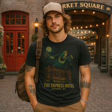 Man wearing a t-shirt with 'The Empress Hotel' design in front of Market Square.