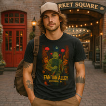 Man wearing a black t-shirt with a graphic design, standing in front of Market Square entrance.