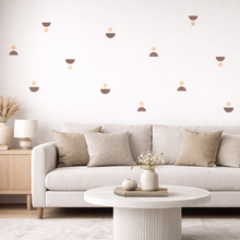 Modern living room with a white sofa, coffee table, and decorative elements.