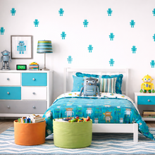 Children's bedroom with blue and green bedding, toys, and decor.