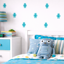 Children's bedroom with robot theme, including bedding, pillows, and decor.