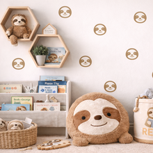Children's room with sloth-themed decor, including plush toys and wall decals.